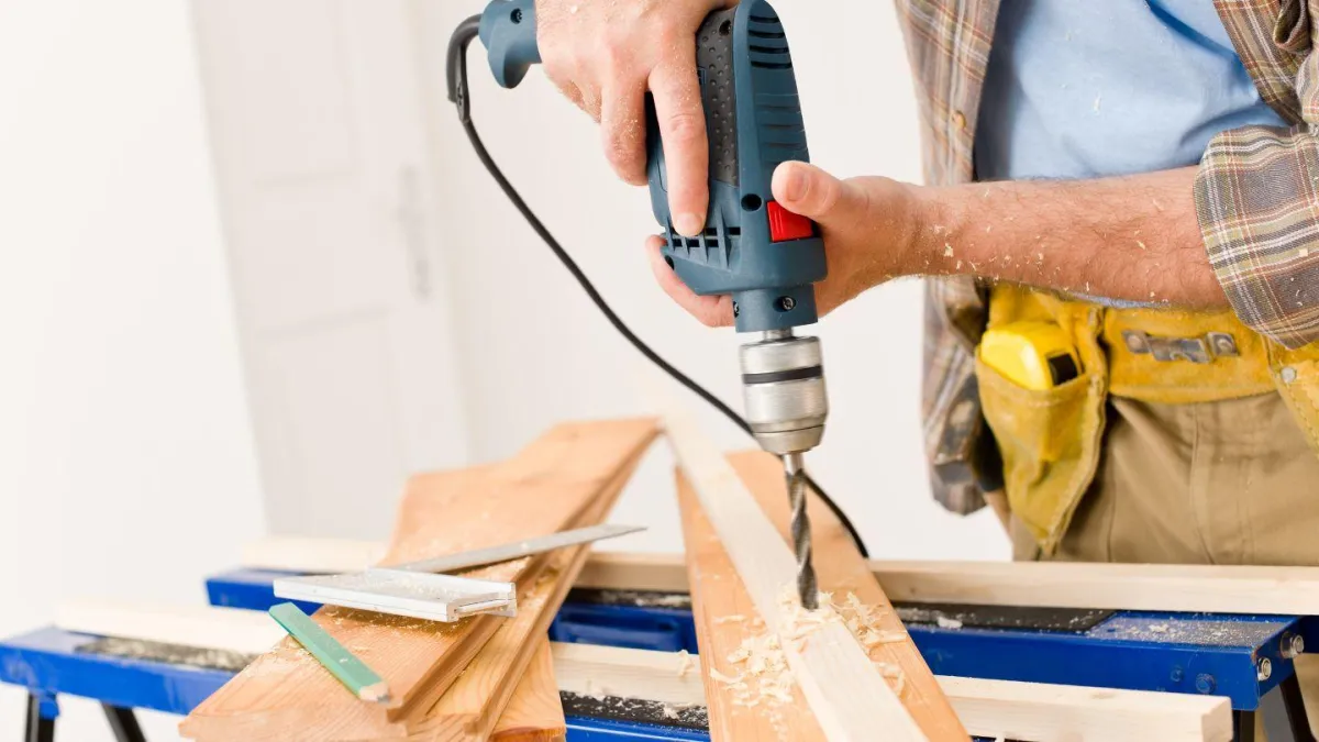 Carpenter cutting trim on a job site