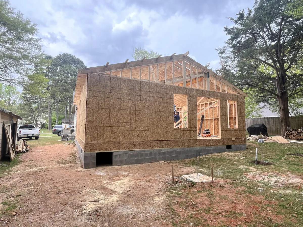 Home addition framed and joined to an existing house